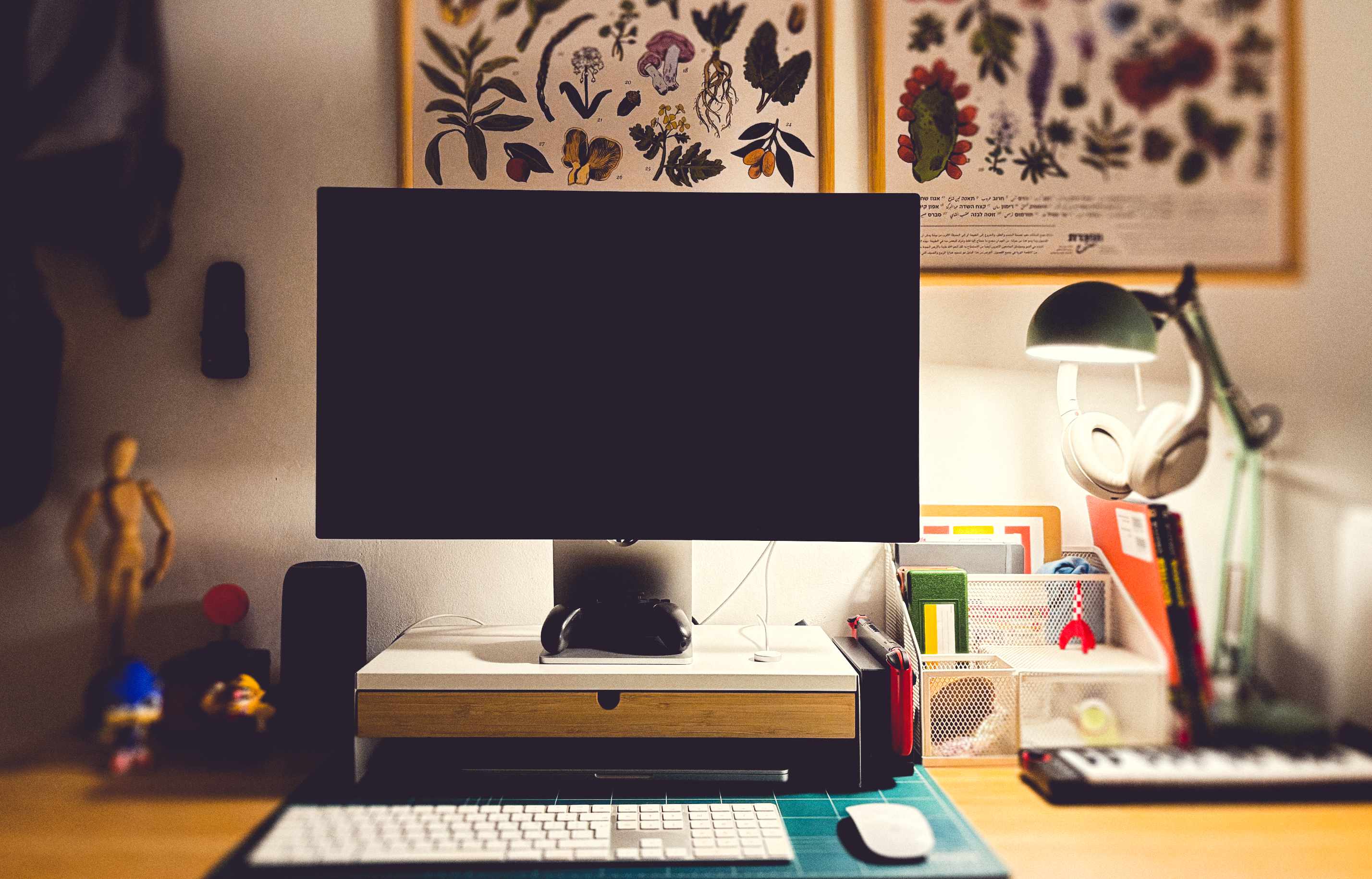 Ido's home office setup, featuring an Apple Studio Display, MacBook Pro and peripherals